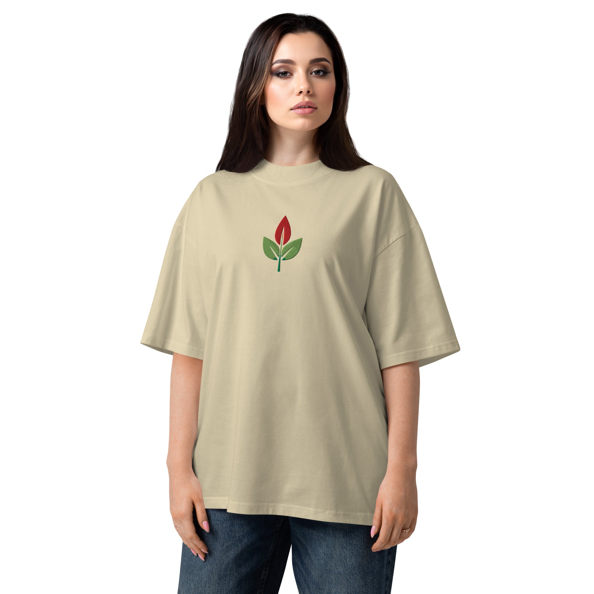 Woman wearing a beige t-shirt with a red flower design on a white background