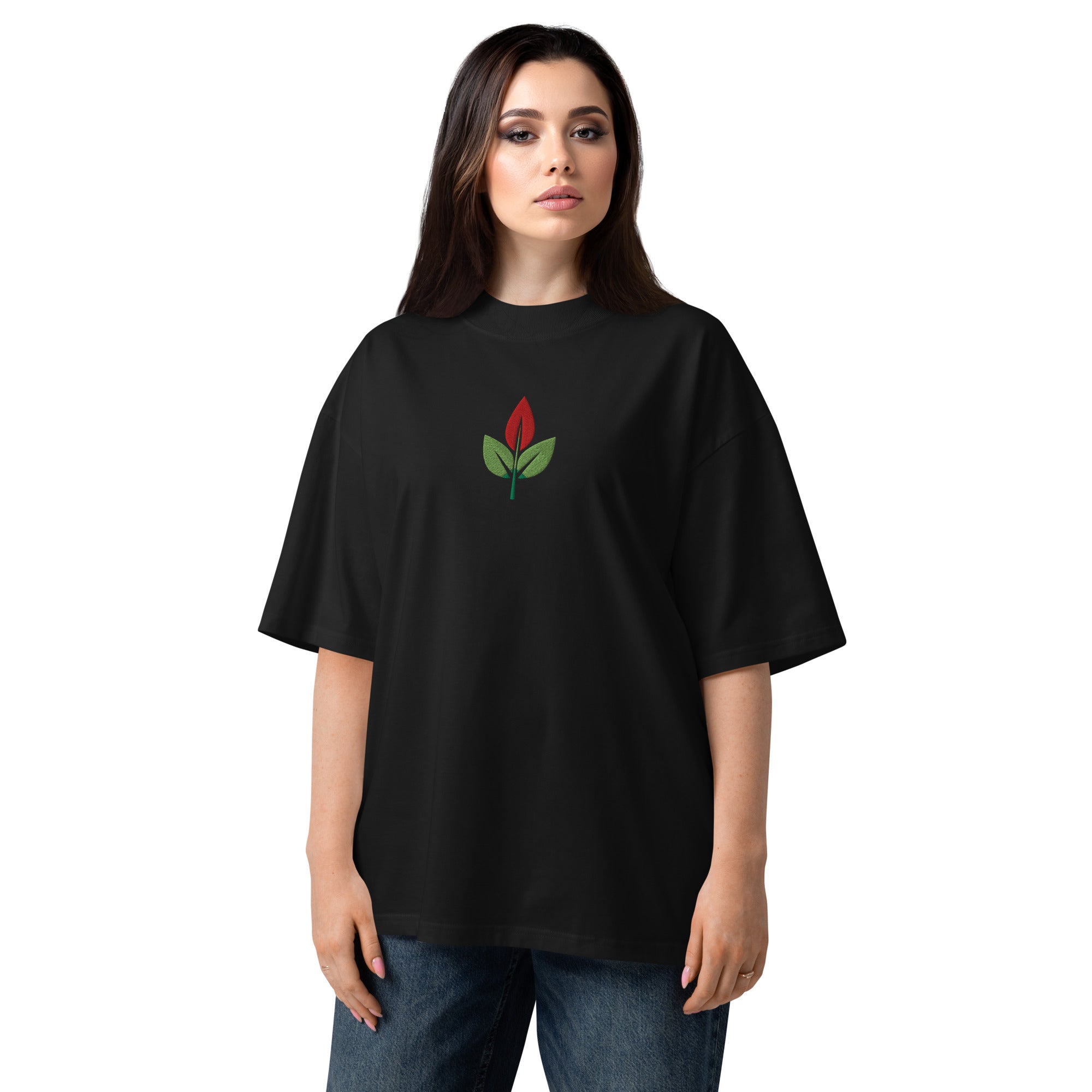 Person wearing a black t-shirt with a red and green logo on a white background