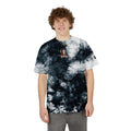 Person wearing a black and white tie-dye t-shirt with a graphic design on a white background