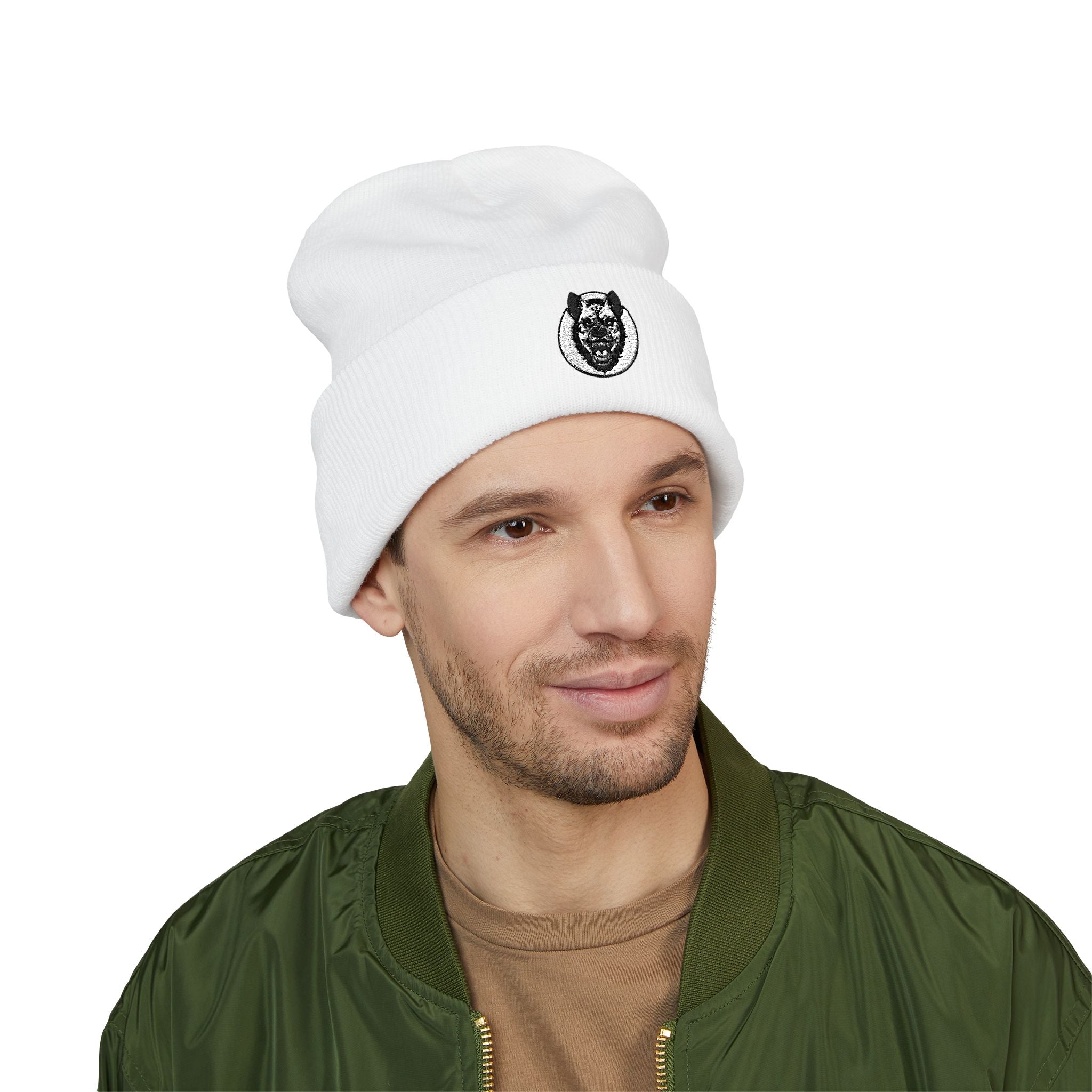 Man wearing a white beanie with a logo on a white background