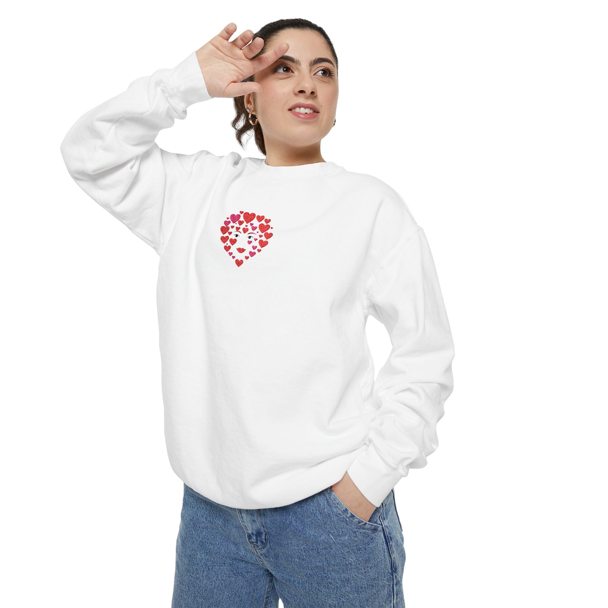 Person wearing a white sweatshirt with a red heart design on a white background