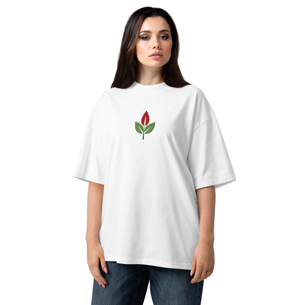Woman wearing a white t-shirt with a red flower design on a white background