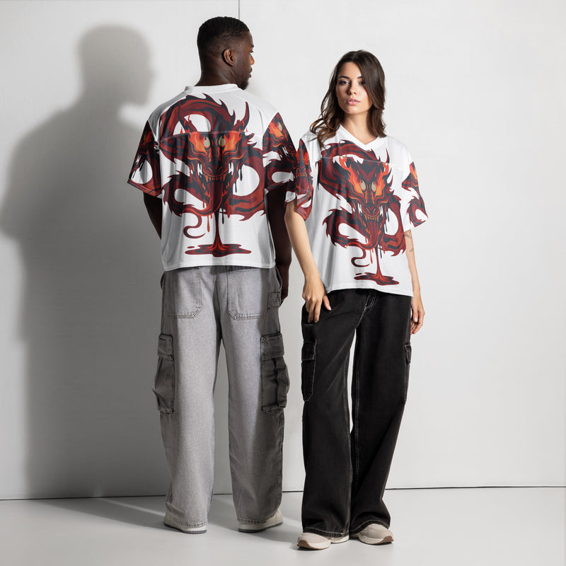 Two people wearing matching outfits with a red and black design on a white background