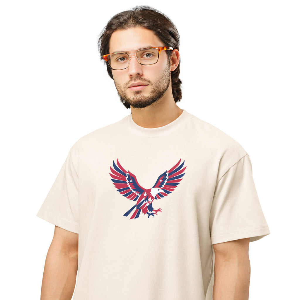 Man wearing a beige t-shirt with an eagle graphic design on a white background