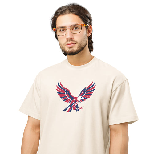 Man wearing a beige t-shirt with an eagle graphic design on a white background