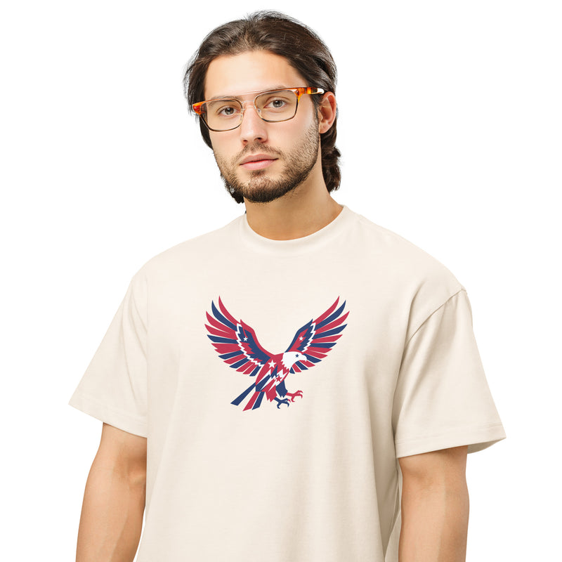 Man wearing a beige t-shirt with an eagle graphic design on a white background