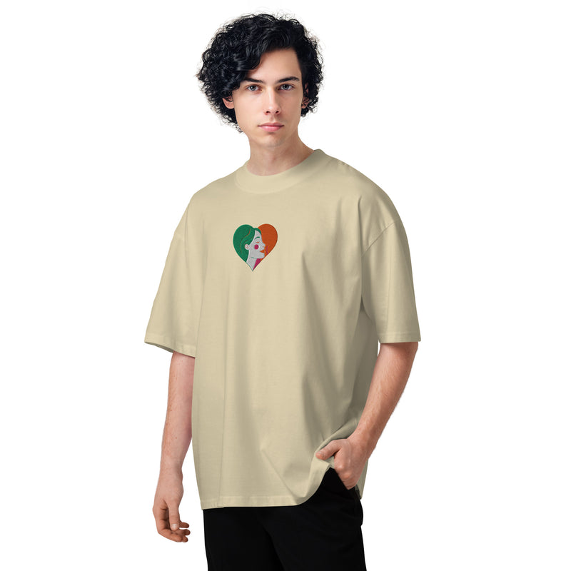 Person wearing a beige t-shirt with a heart design on a white background