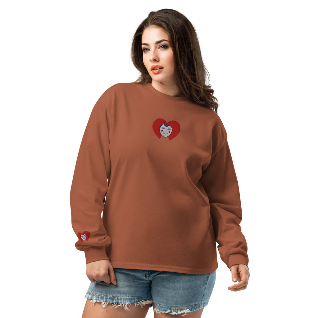 Woman wearing a brown long-sleeve shirt with a heart design on a white background