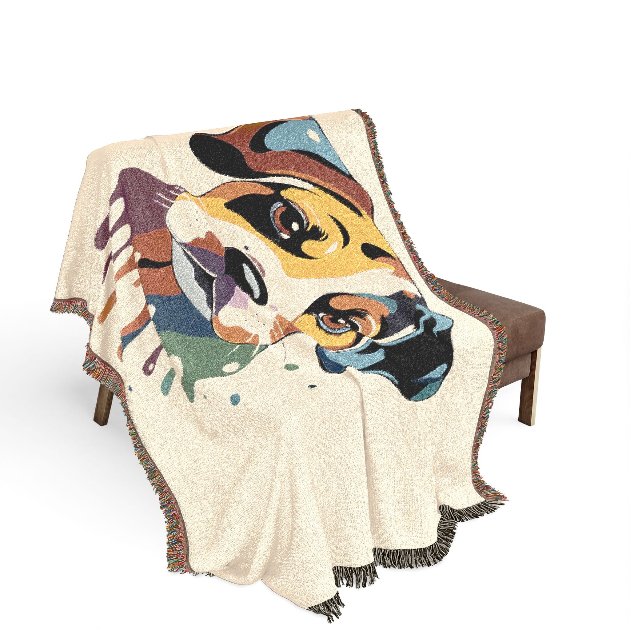 Colorful animal-themed blanket draped over a chair on a white background
