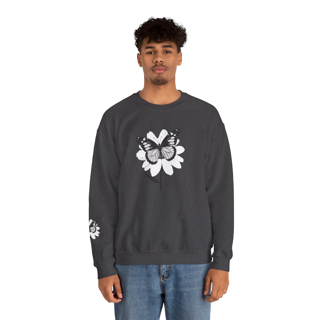 Person wearing a dark gray sweatshirt with a white floral design on a white background