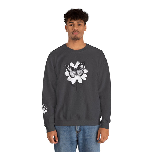 Person wearing a dark gray sweatshirt with a white floral design on a white background