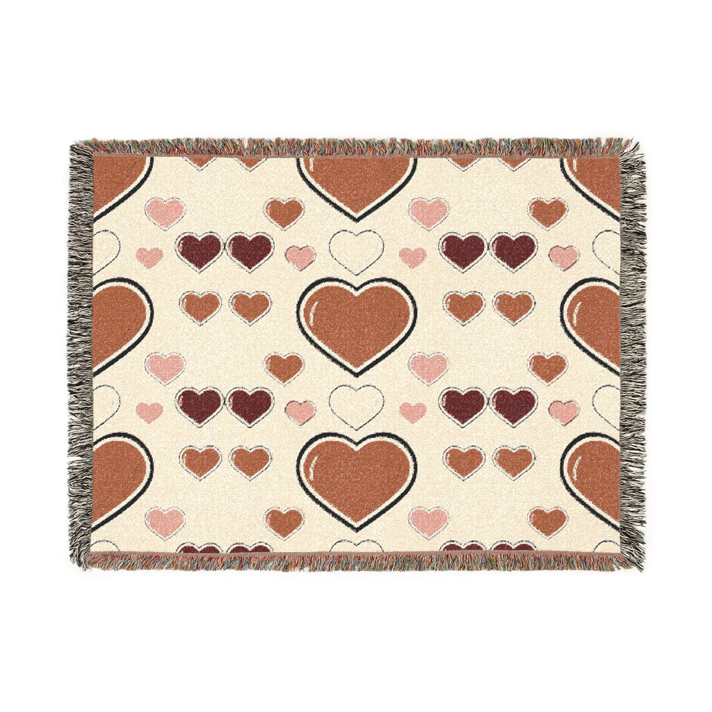 Heart-patterned blanket with brown and pink hearts on a beige background