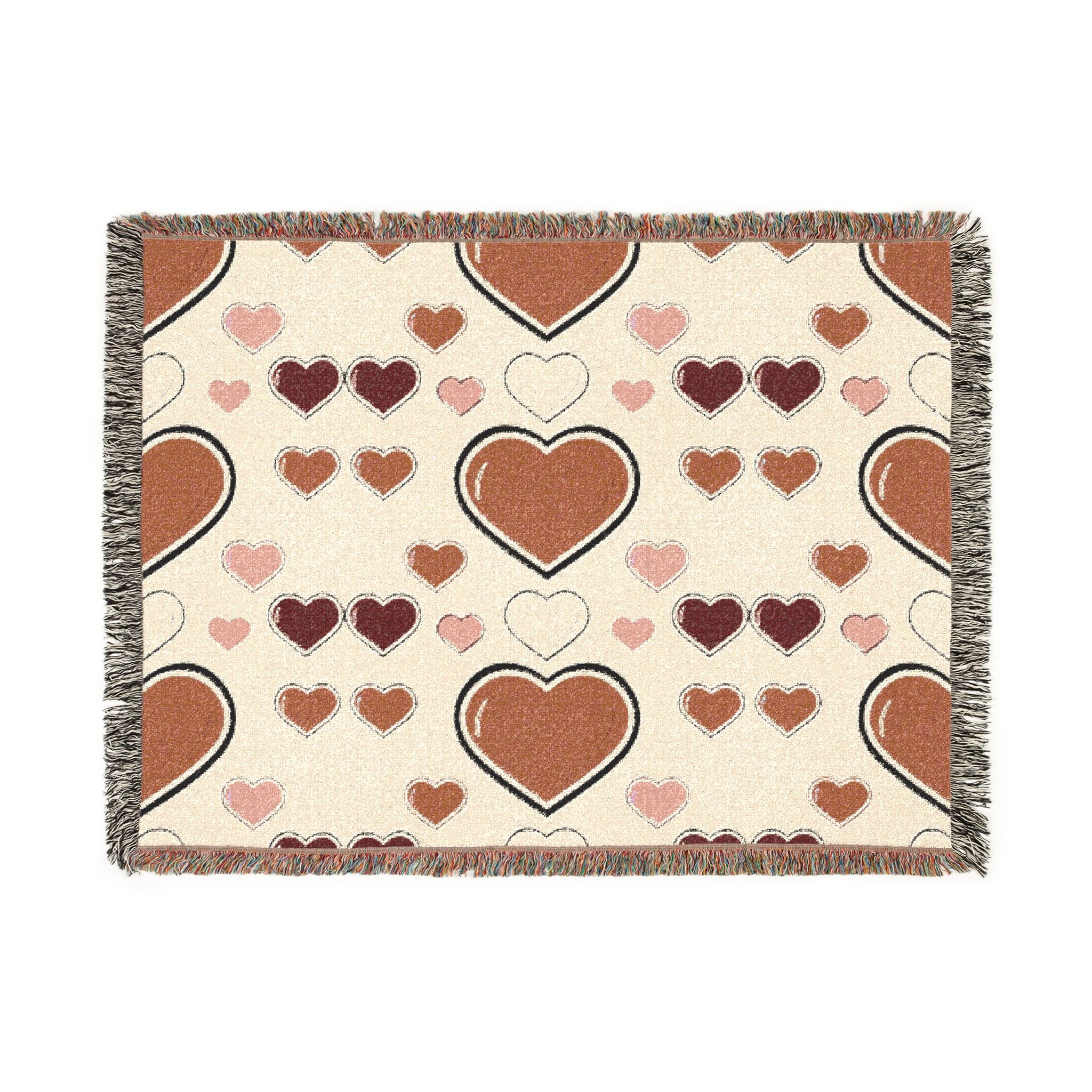 Heart-patterned blanket with brown and pink hearts on a beige background