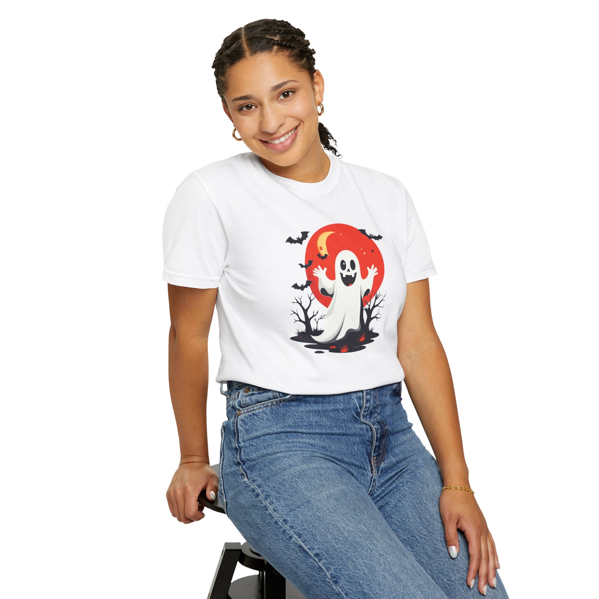 Person wearing a white t-shirt with a ghost graphic on a white background