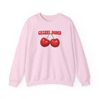 Pink sweatshirt with cherry design and 'CHERRY BOMB' text on a white background