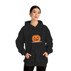 Person wearing a black hoodie with a pumpkin design on a white background
