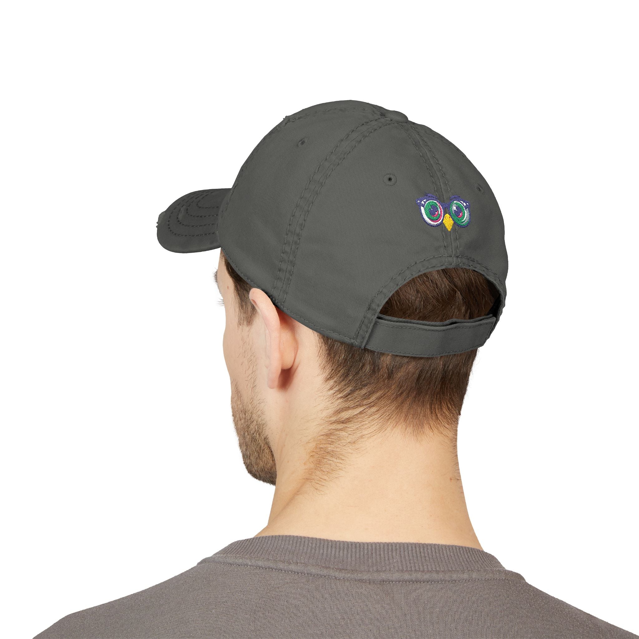 Person wearing a gray cap on a white background