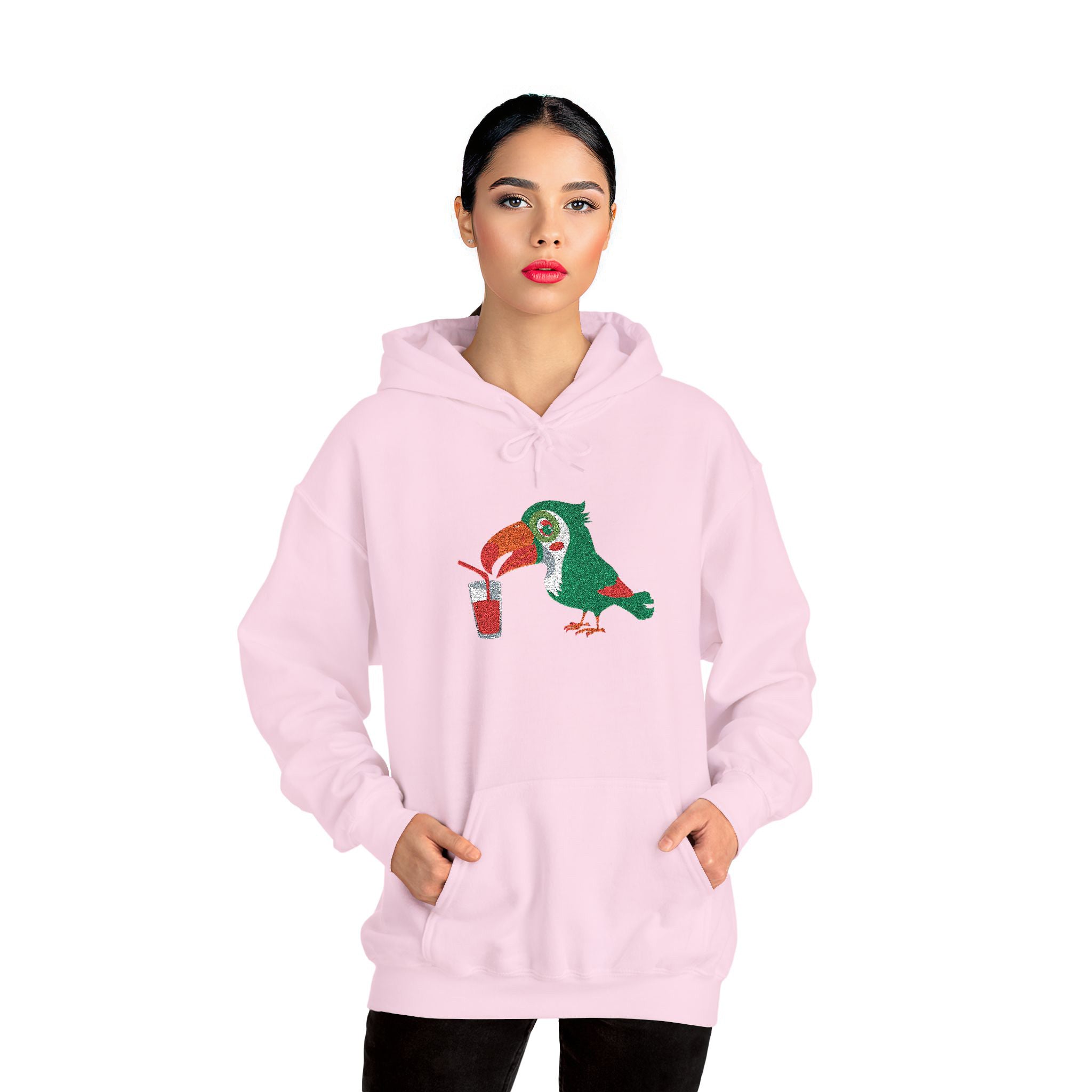 Pink hoodie with a parrot design worn by a model on a white background