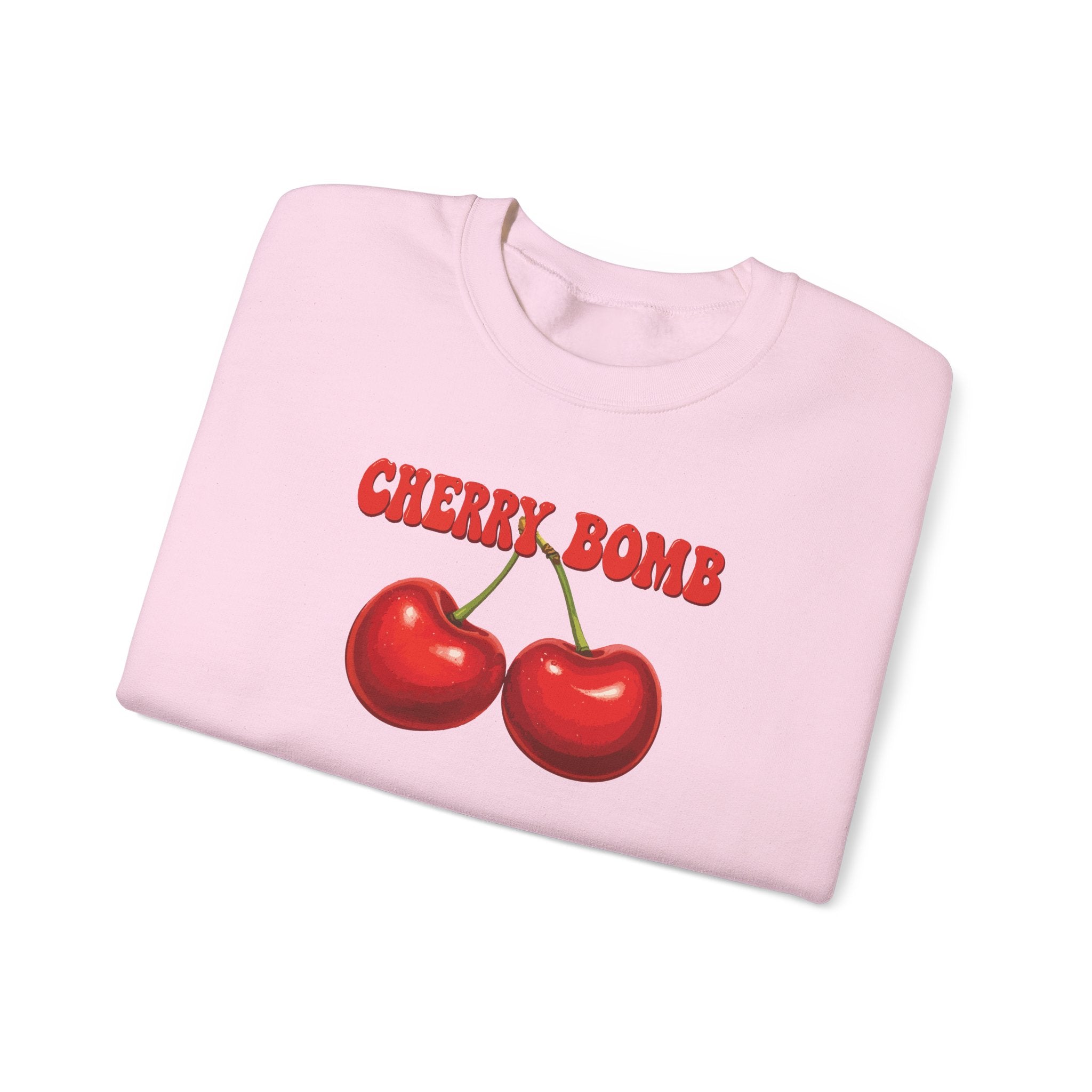 Pink sweatshirt with cherry design and 'Cherry Bomb' text on a white background