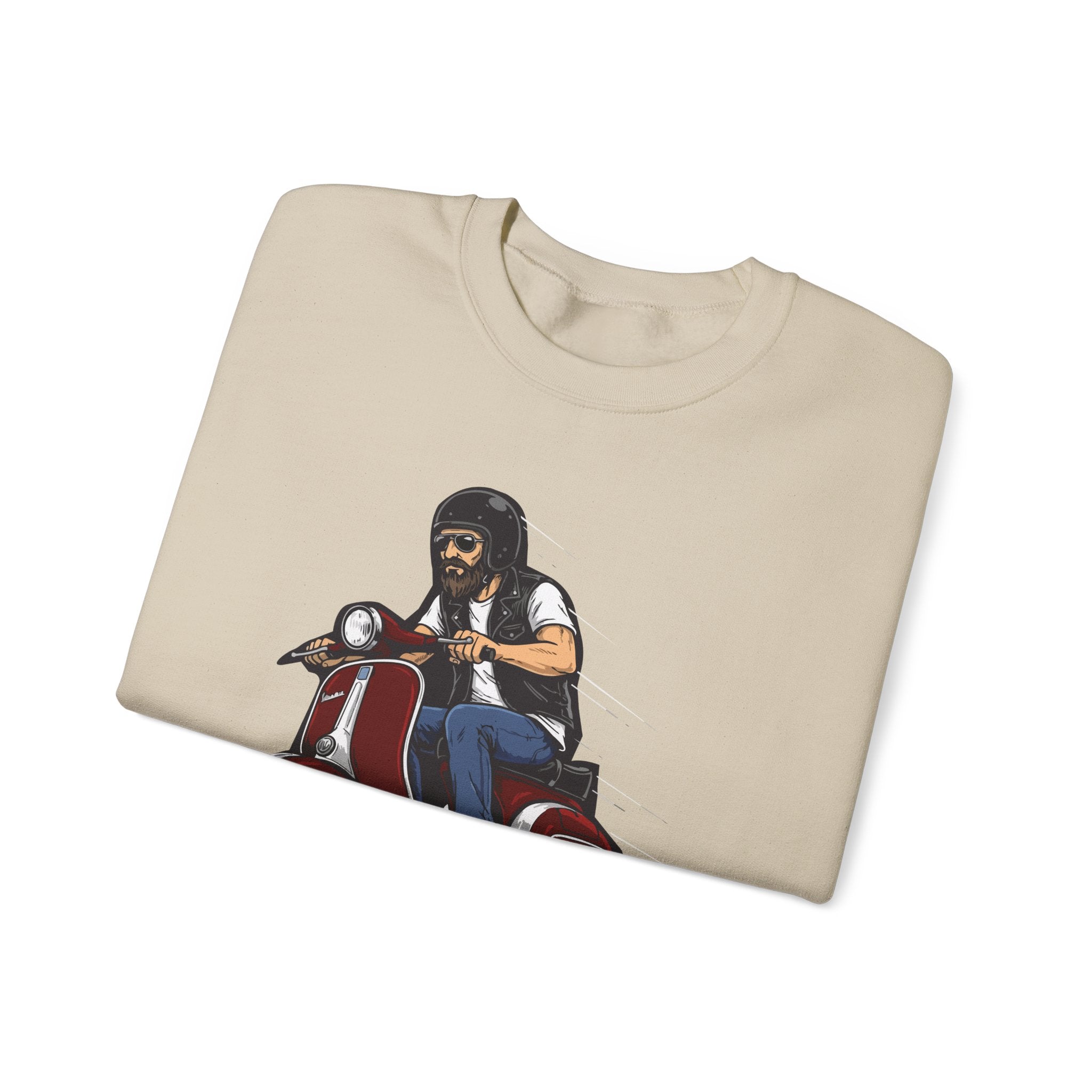 Folded beige t-shirt with a graphic of a person on a motorcycle on a white background