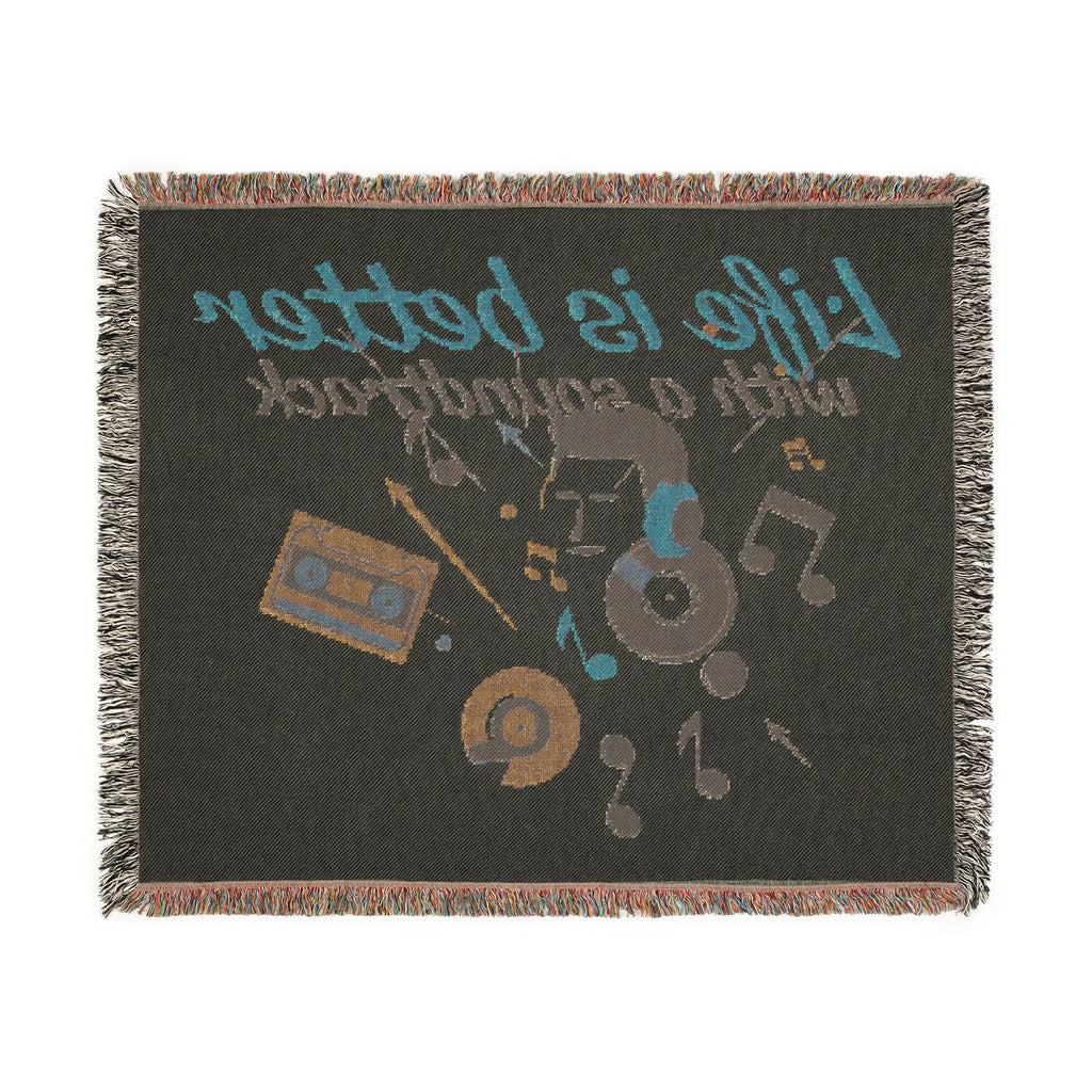 Blanket with music-themed design featuring cassette tape, vinyl record, and text on a black background.