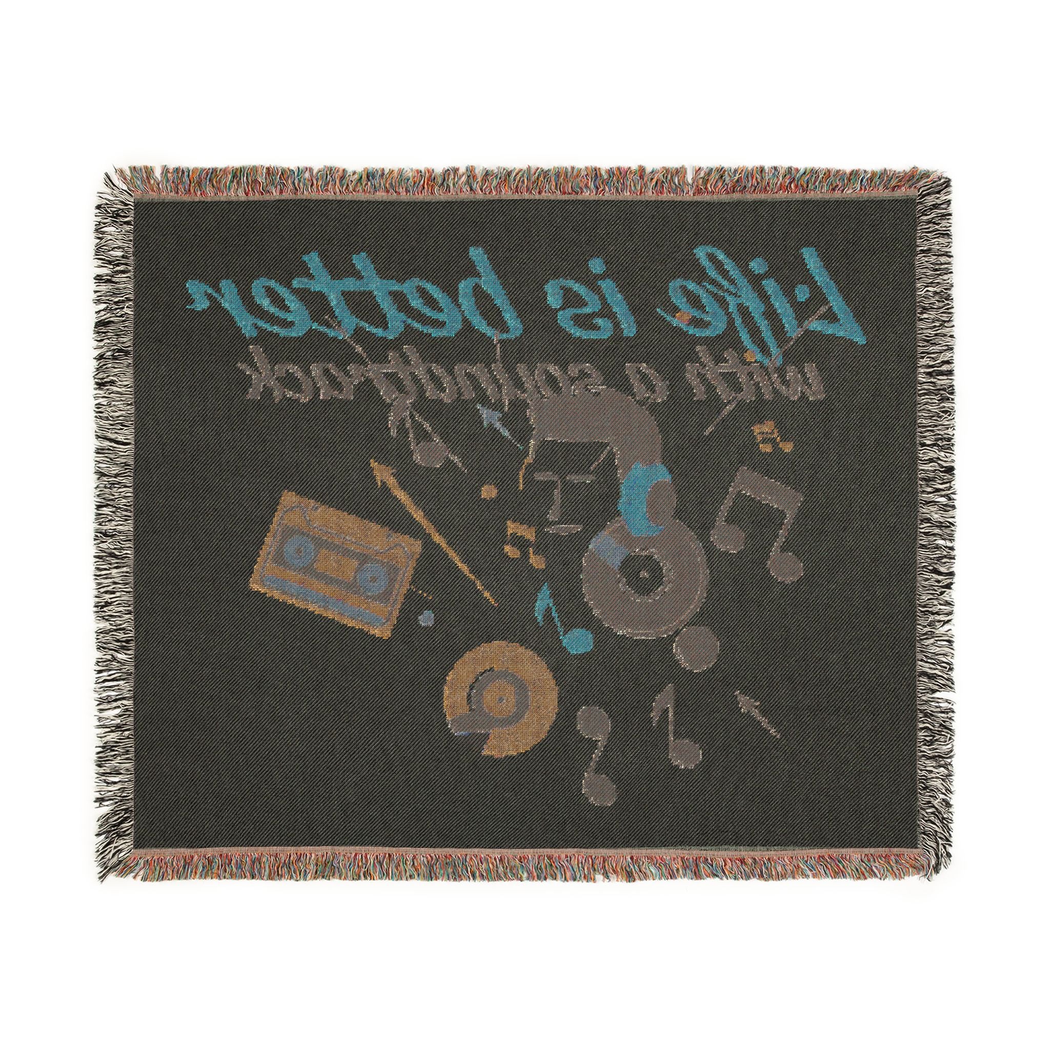 Blanket with music-themed design featuring cassette tape, vinyl record, and text on a black background.