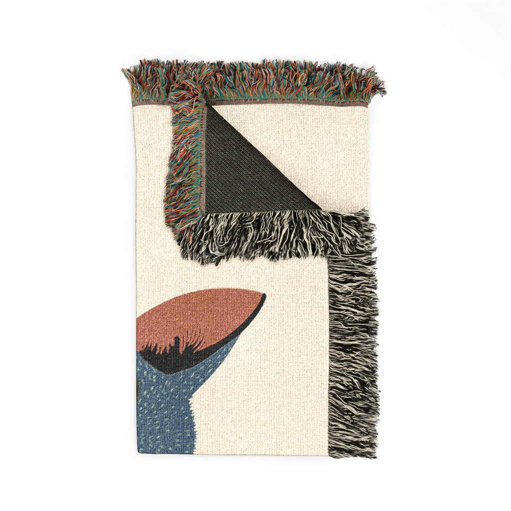 Textile with geometric pattern and fringes on a white background