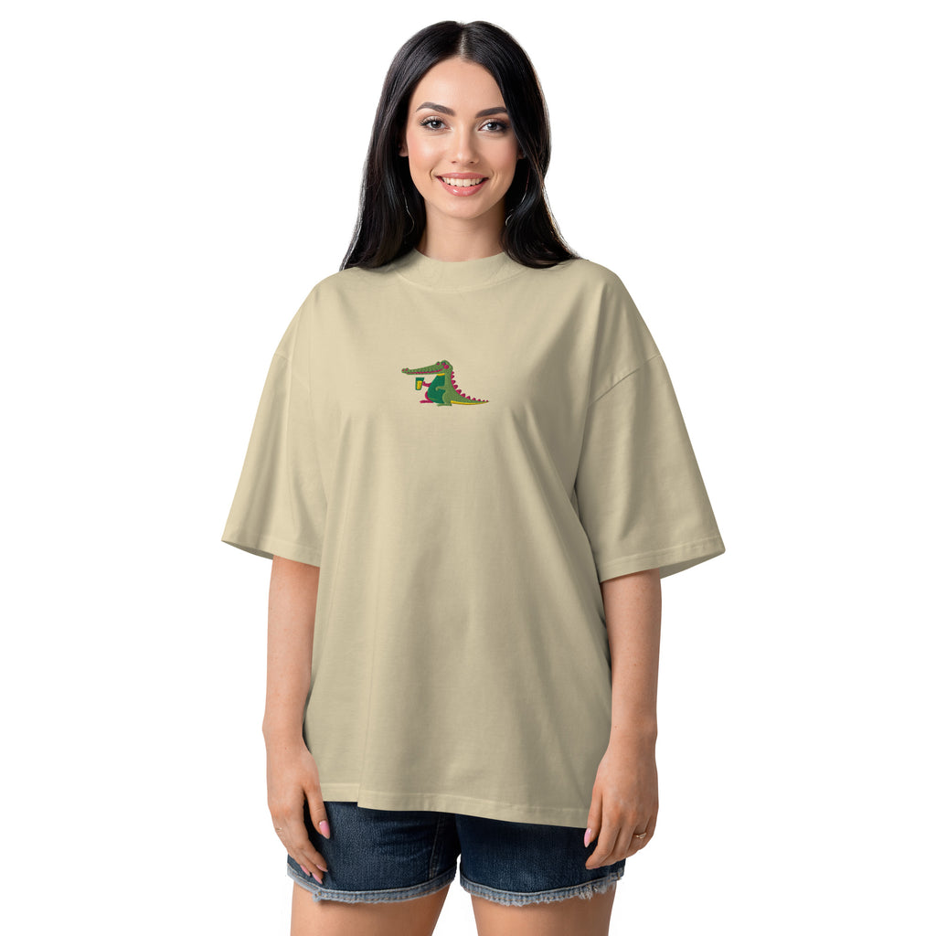 Woman wearing a beige t-shirt with a graphic design on a white background