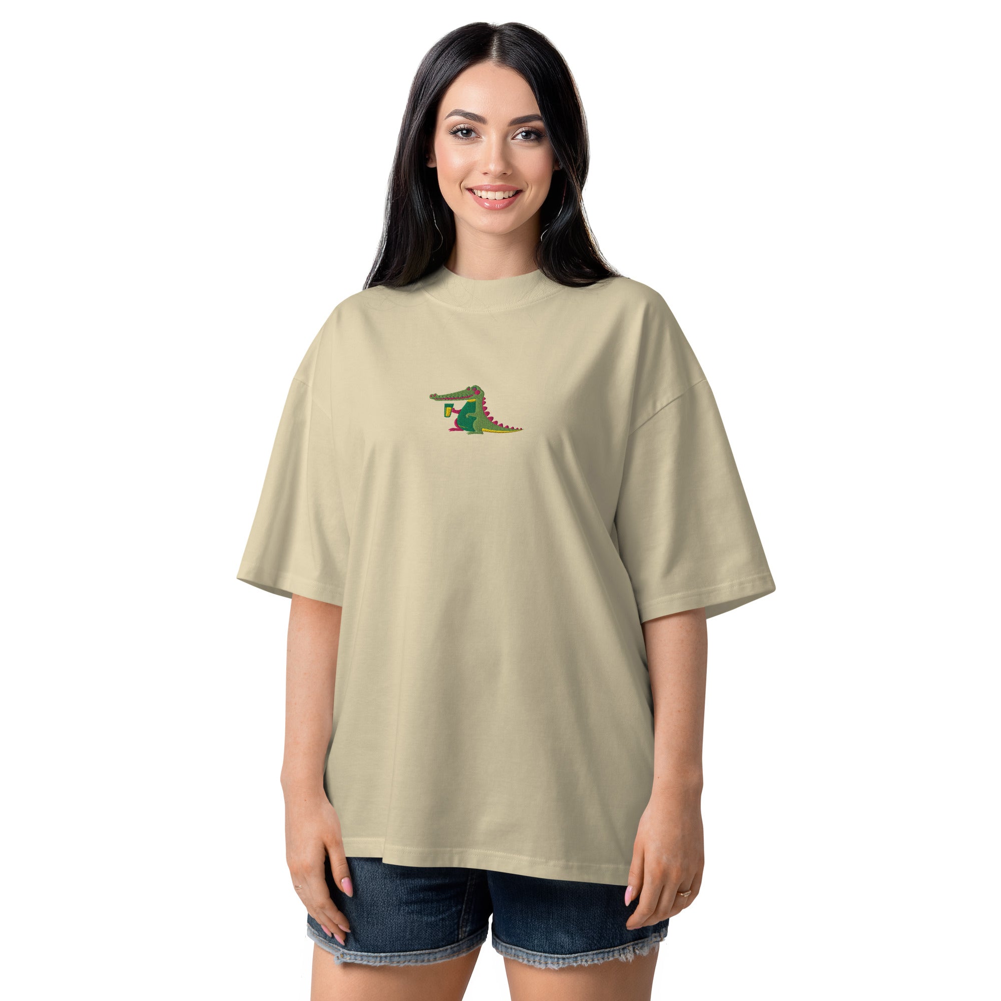 Woman wearing a beige t-shirt with a graphic design on a white background