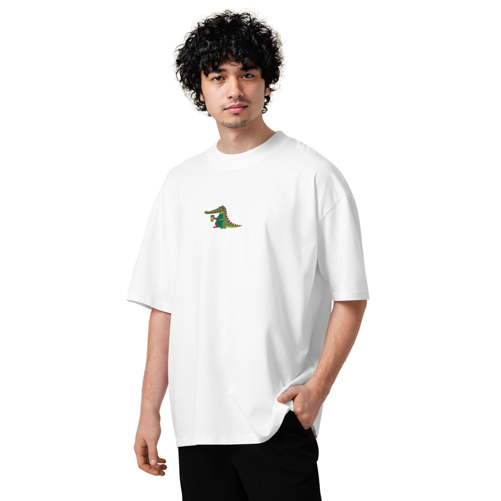Person wearing a white t-shirt with a small graphic on a white background