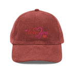 Red cap with 'love you' embroidery on a white background