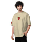 Person wearing a beige t-shirt with a red and green graphic on a white background