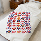 Colorful heart-patterned blanket on a bed in a bedroom setting