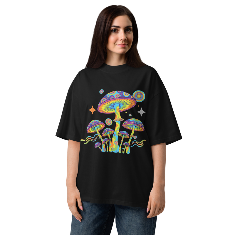 Person wearing a black t-shirt with colorful mushroom design on a white background