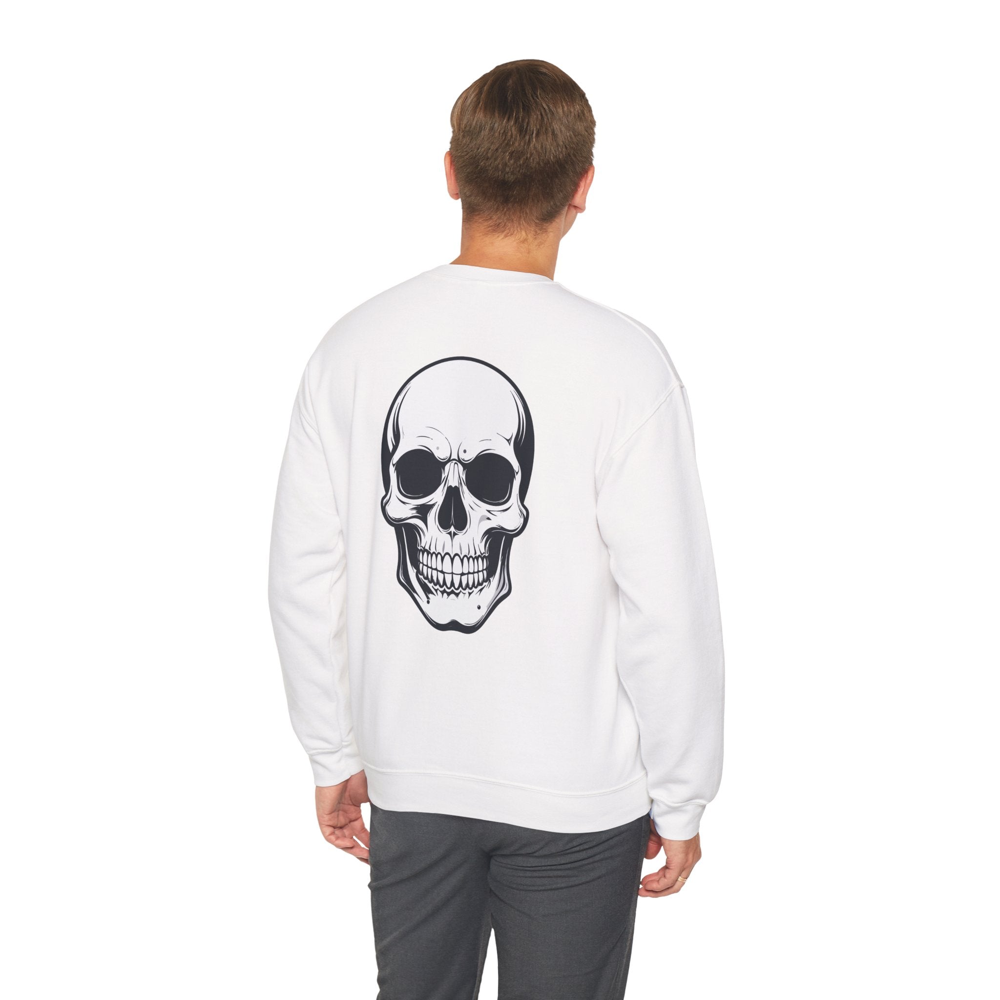 Person wearing a white sweatshirt with a skull design on the back against a white background