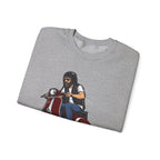 Folded gray t-shirt with a graphic of a person on a motorcycle on a white background