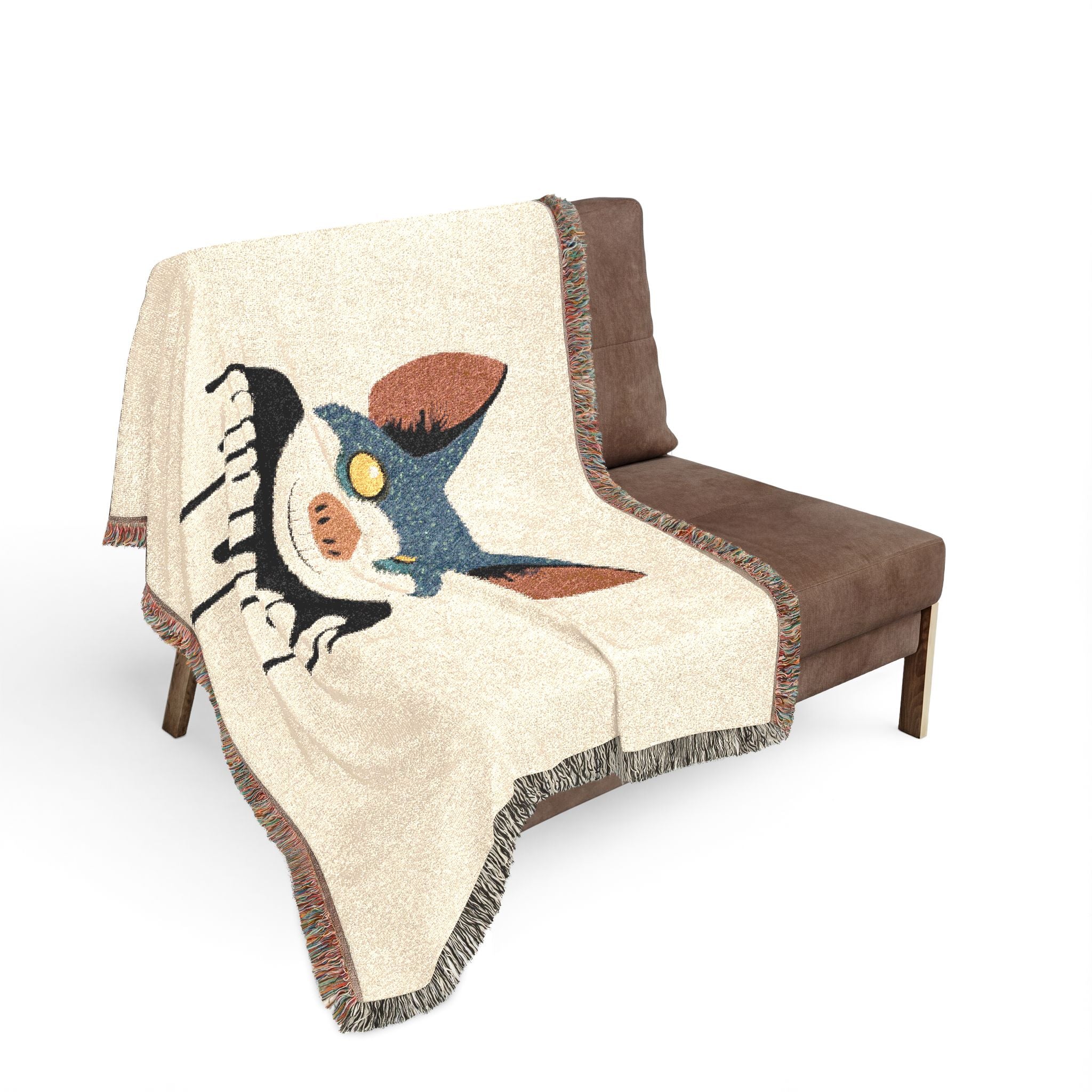 Decorative blanket with a cartoon character draped over a brown chair on a white background