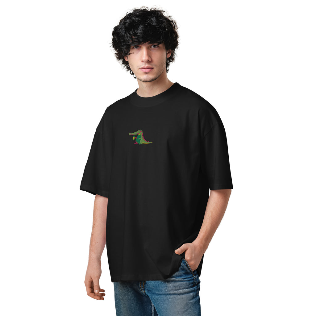 Person wearing a black t-shirt with a small graphic on a white background