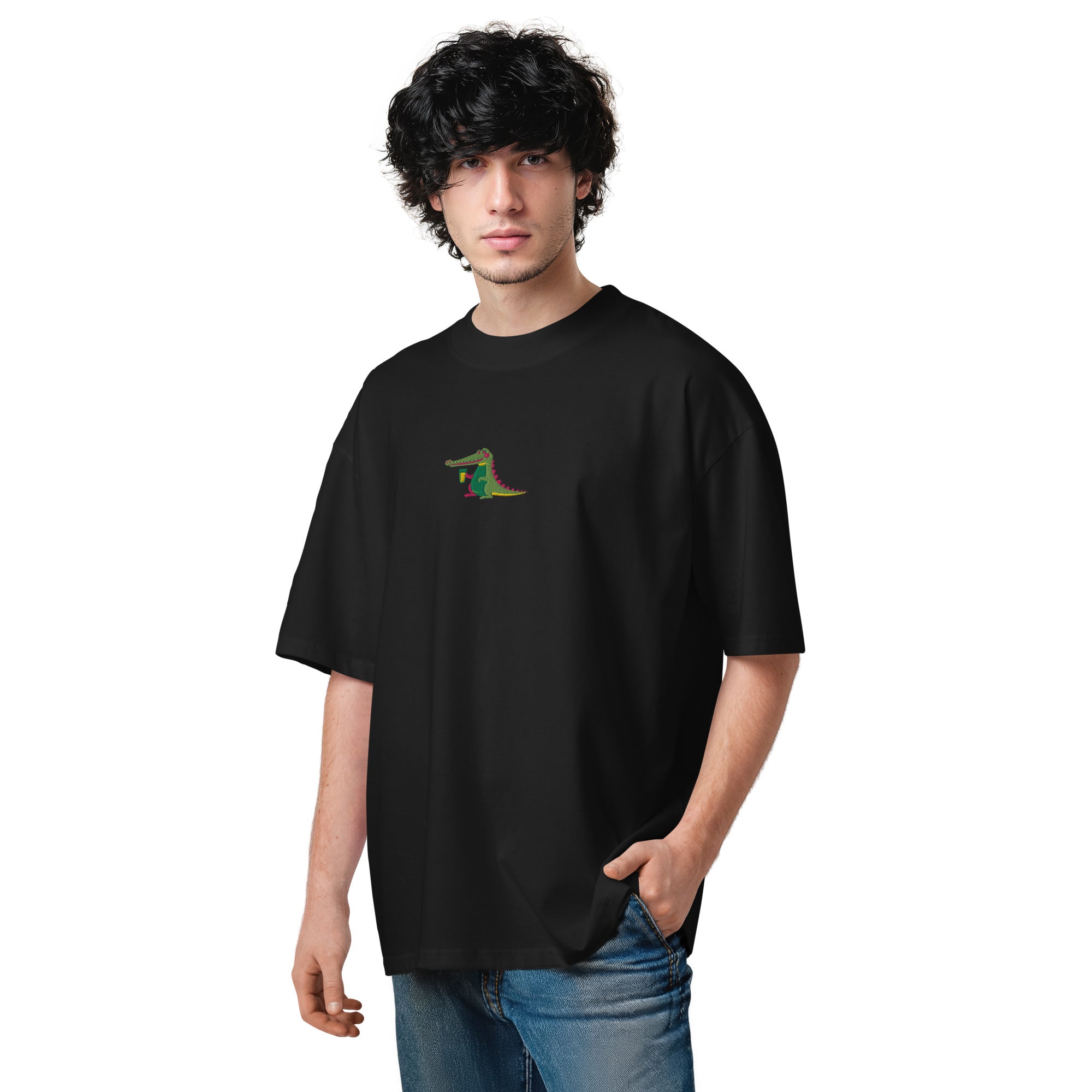 Person wearing a black t-shirt with a small graphic on a white background