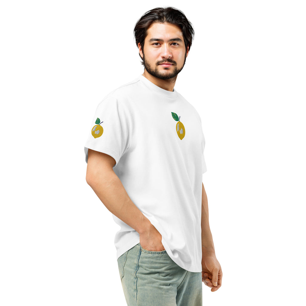 Man wearing a white t-shirt with lemon designs on a white background