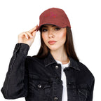 Woman wearing a maroon cap with text and hearts on a white background