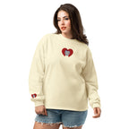 Woman wearing a cream long-sleeve shirt with a heart-shaped logo on a white background