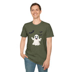 Person wearing a green t-shirt with a ghost and bat design on a white background
