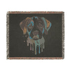 Blanket with a dog's face design on a black background
