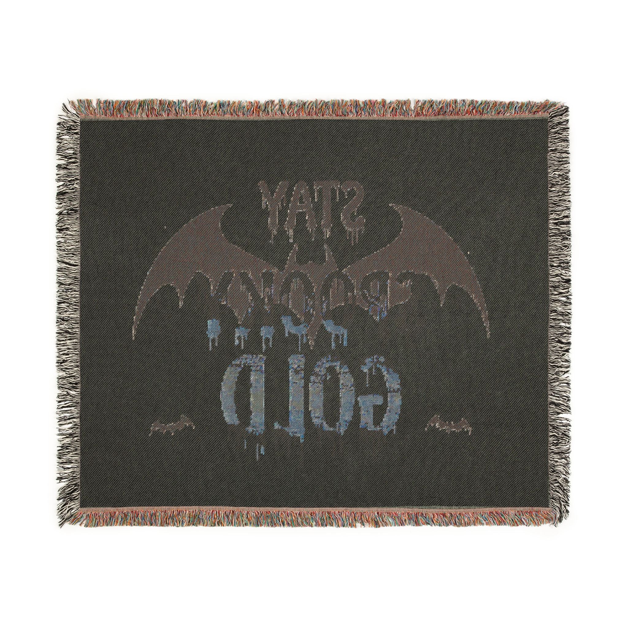 Black blanket with bat design and text on a white background