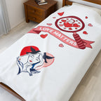 Bedspread with artistic design and 'Love Matters' text on a bed in a room.