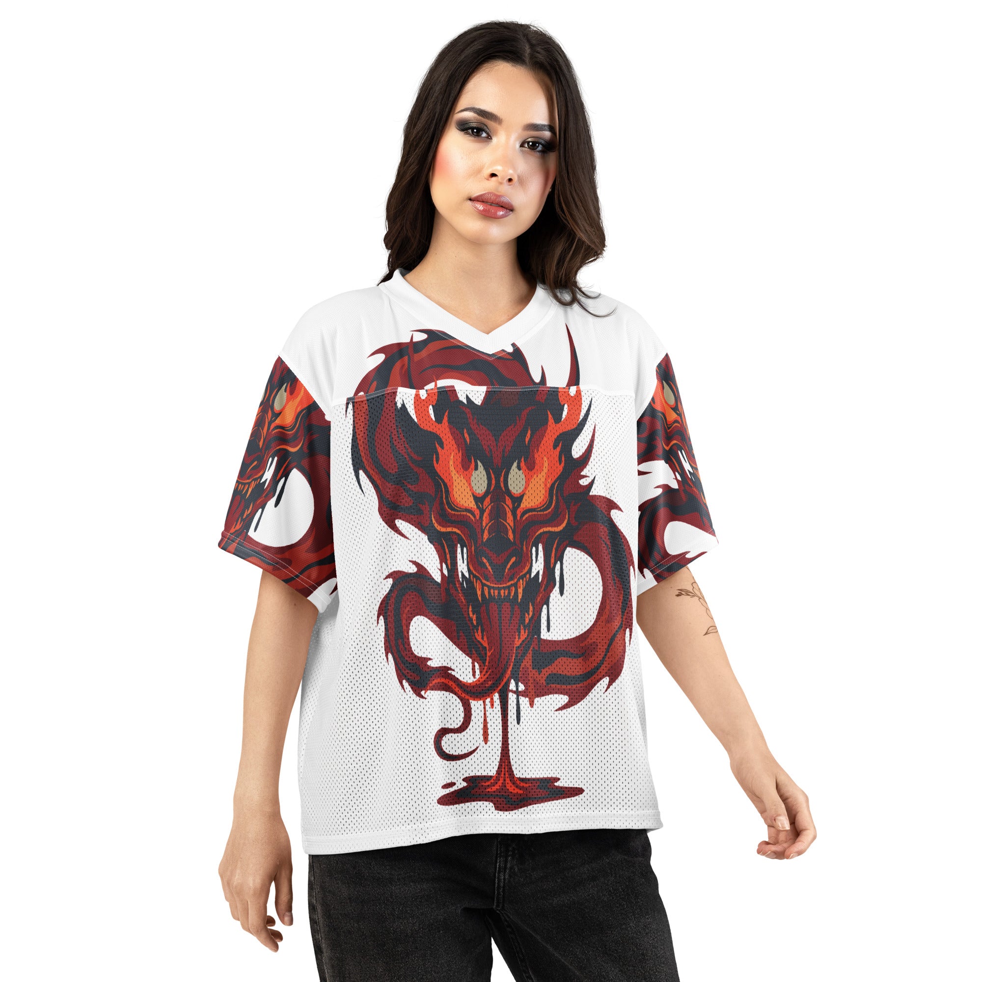 Woman wearing a white jersey with a red dragon design on a white background
