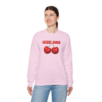 Person wearing a pink sweatshirt with cherry design and 'Cherry Bomb' text on a white background