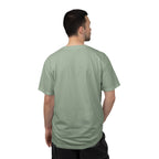 Man wearing a light green t-shirt on a white background