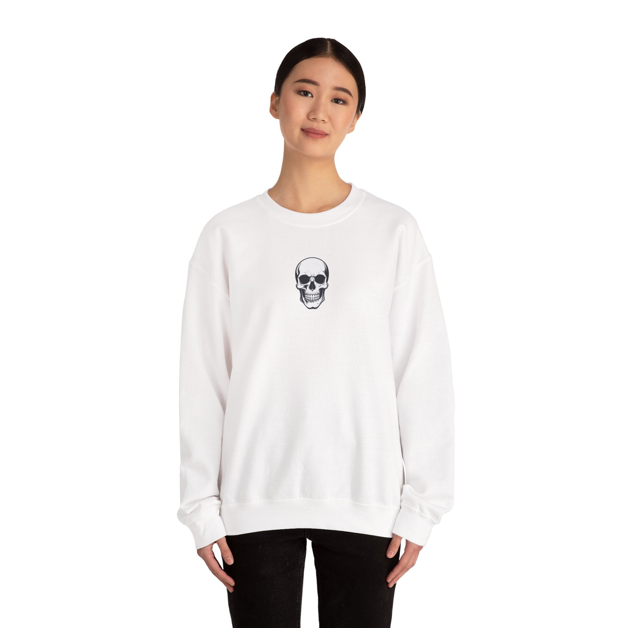 Person wearing a white sweatshirt with a skull design on a white background